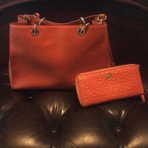 Authentic Michael Kors handbag with wallet.